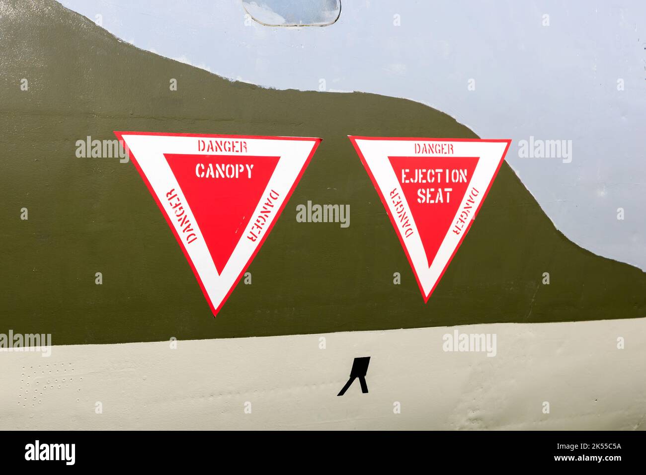 Danger Canopy and Ejection seat  signs  on the side  an old jet plane Stock Photo