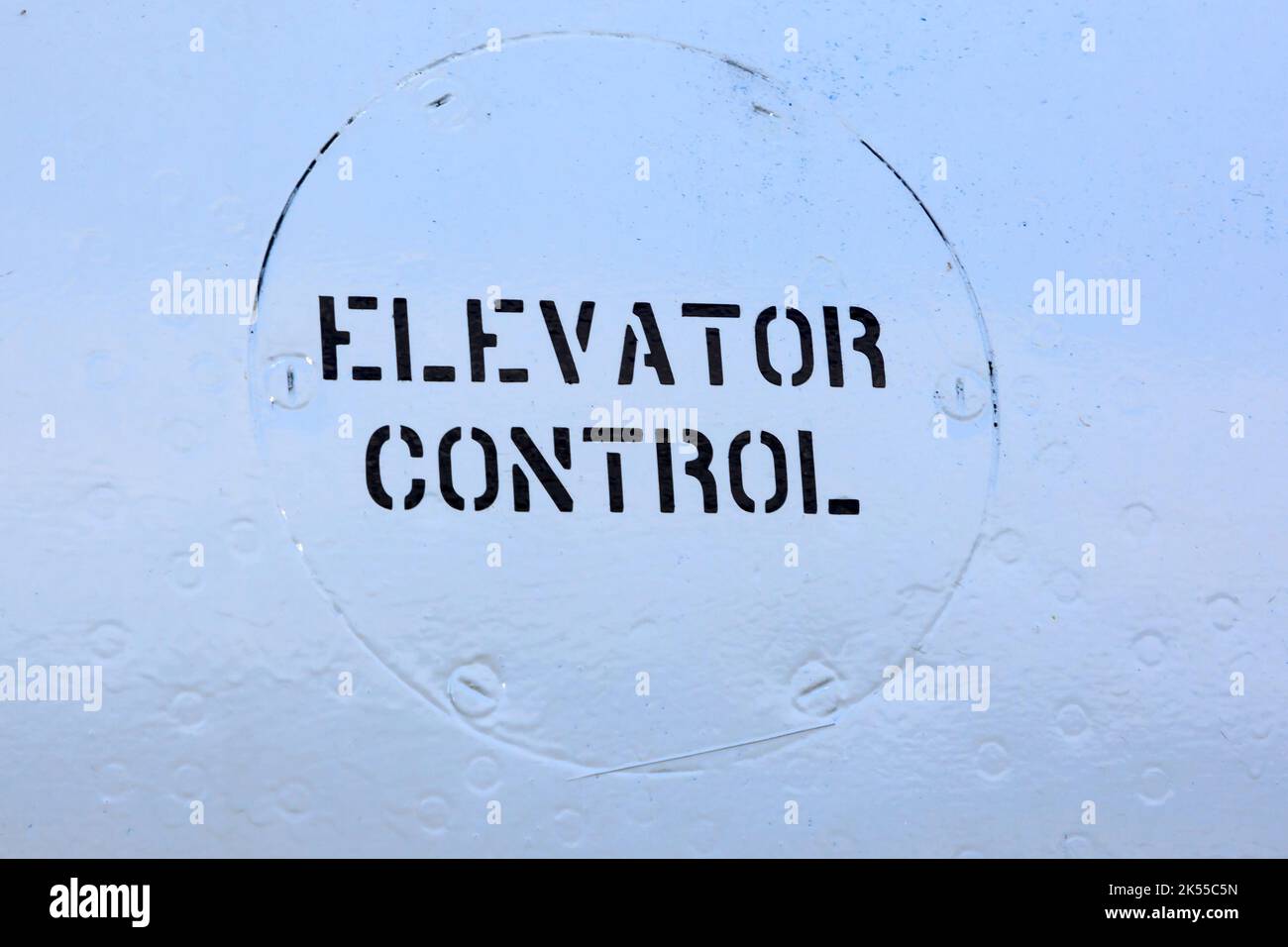 elevator control sign painted on the the side fo an old aircraft Stock Photo