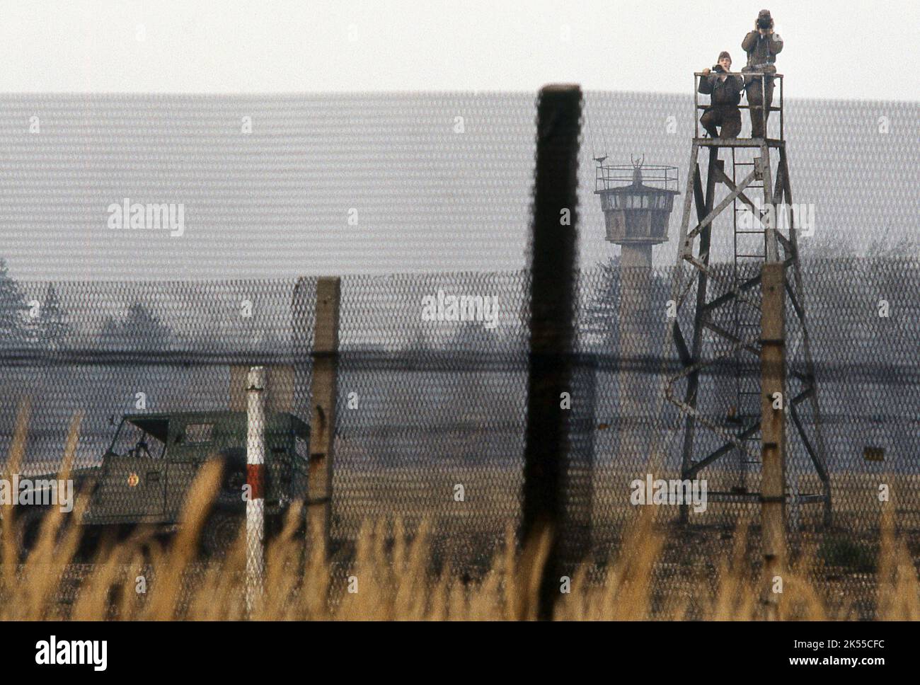 The Iron Curtain. East German boarder Guards looking out from
