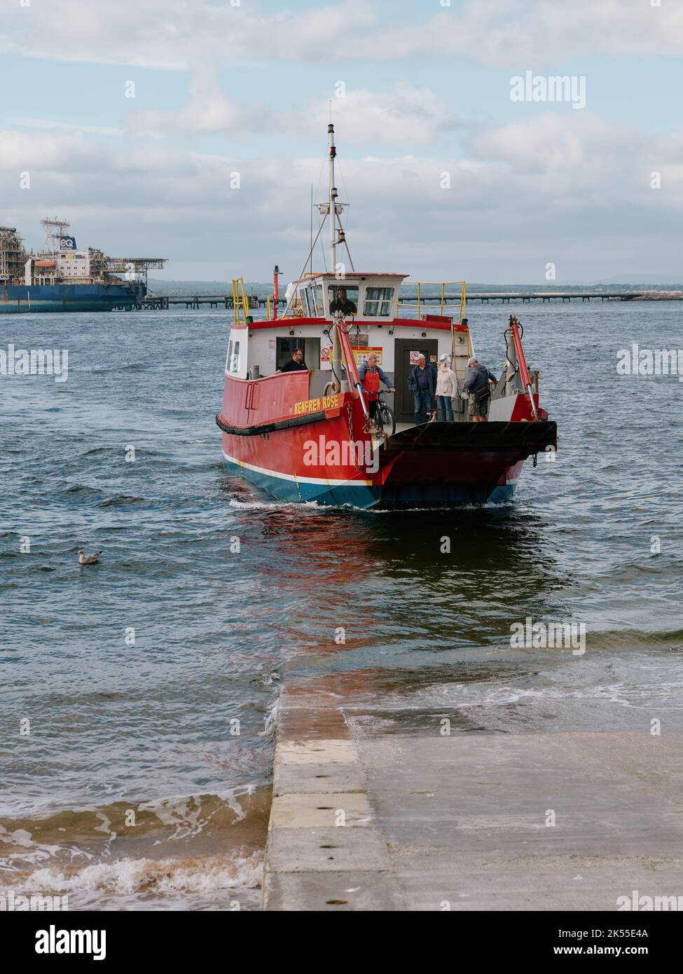The Cromarty-Nigg highland ferry service with foot passengers arriving in Cromarty Harbour, Cromarty, Ross & Cromarty, Highland, Scotland UK Stock Photo