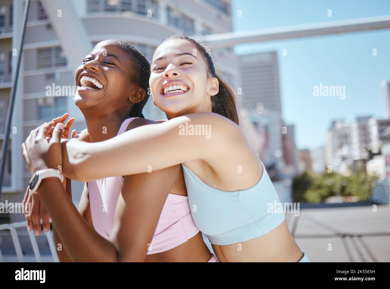 Fitness friends, women and support hug in city workout, running motivation and summer exercise outdoors. Happy, diversity and wellness excited female Stock Photo