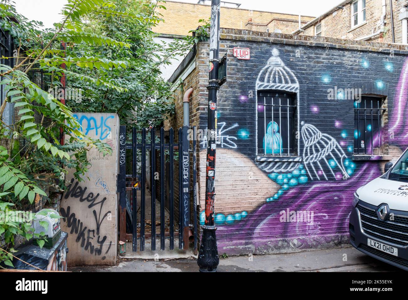 A spray-paint decorated wall in a back alley in Camden Town, London, UK Stock Photo