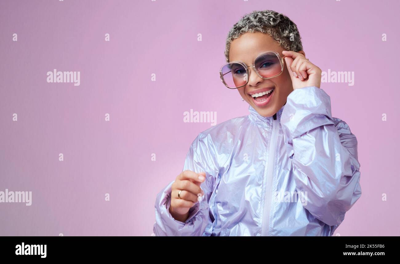 Edgy fashion, trendy and black woman with sunglasses in a studio with mockup space. Stylish, creative and portrait of an african girl influencer or Stock Photo