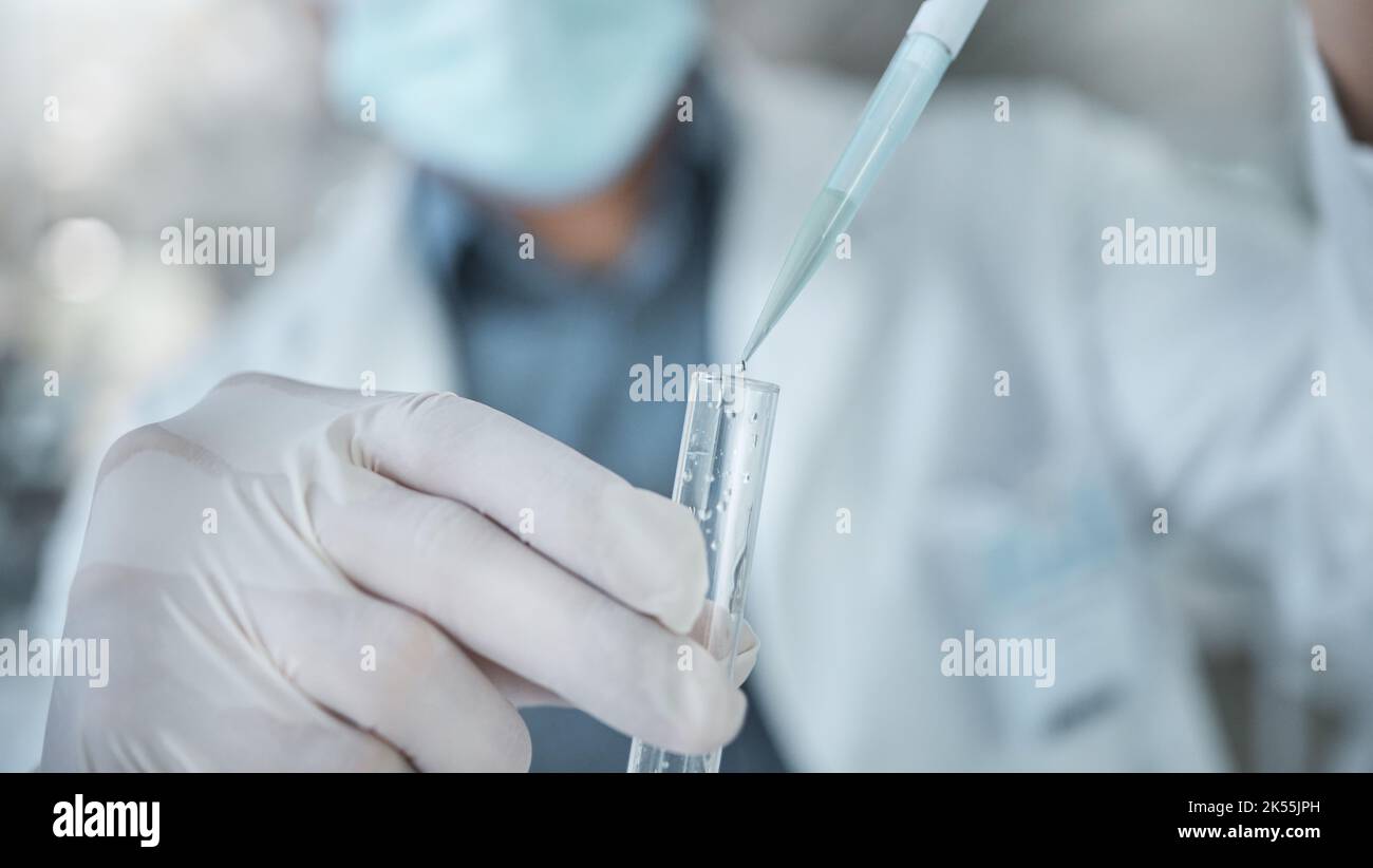 Laboratory man, hands and test tube dropper in medical research, cancer study or healthcare medicine innovation in covid insurance. Zoom on scientist Stock Photo