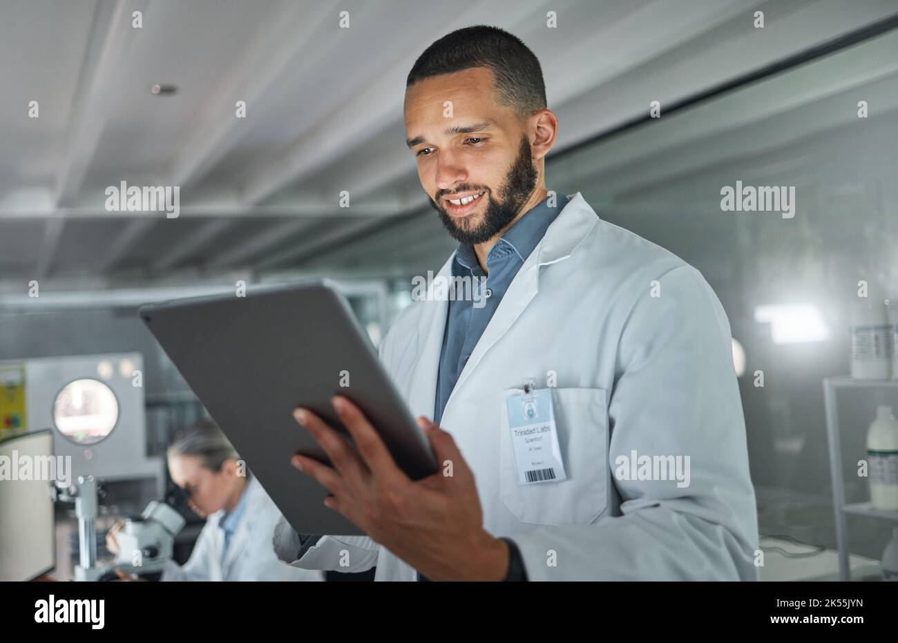 Laboratory man, tablet or research data analysis in medical, healthcare