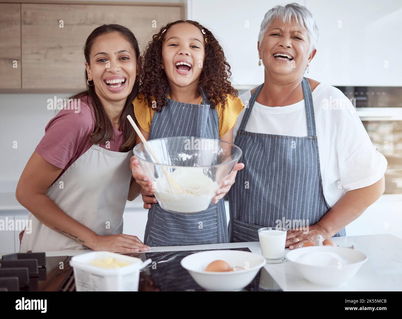 Grandmother, mom and child baking as a happy family in the kitchen with