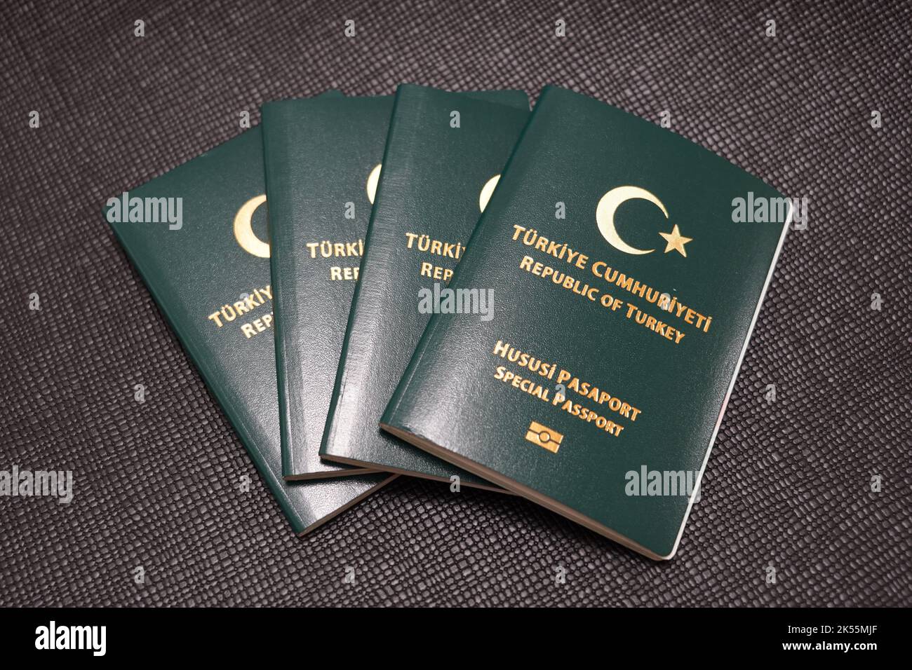four turkey green passports on a black background Stock Photo Alamy