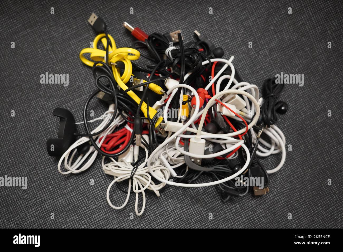 tangled cables of different types on a black background Stock Photo Alamy