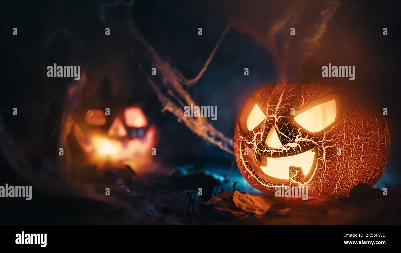 scary halloween pumpkins in the night Stock Photo - Alamy