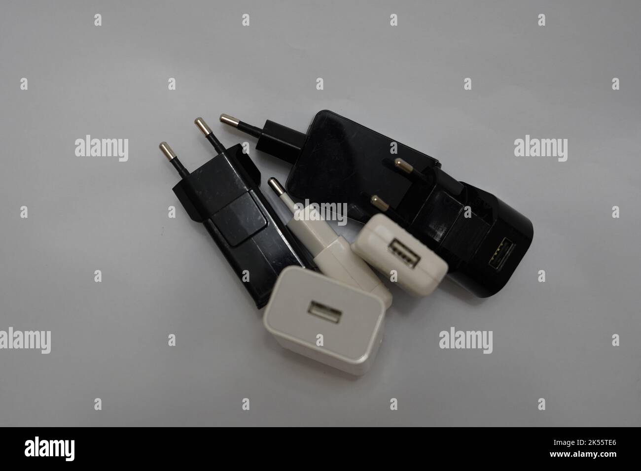 many phone charger adapters of different types on a white background Stock Photo Alamy