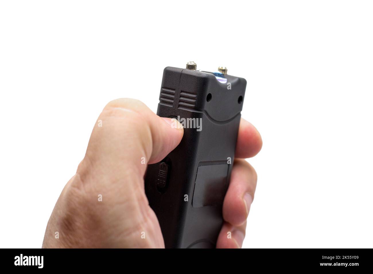 Taser in a man's hand, close-up, isolated white background. Stock Photo