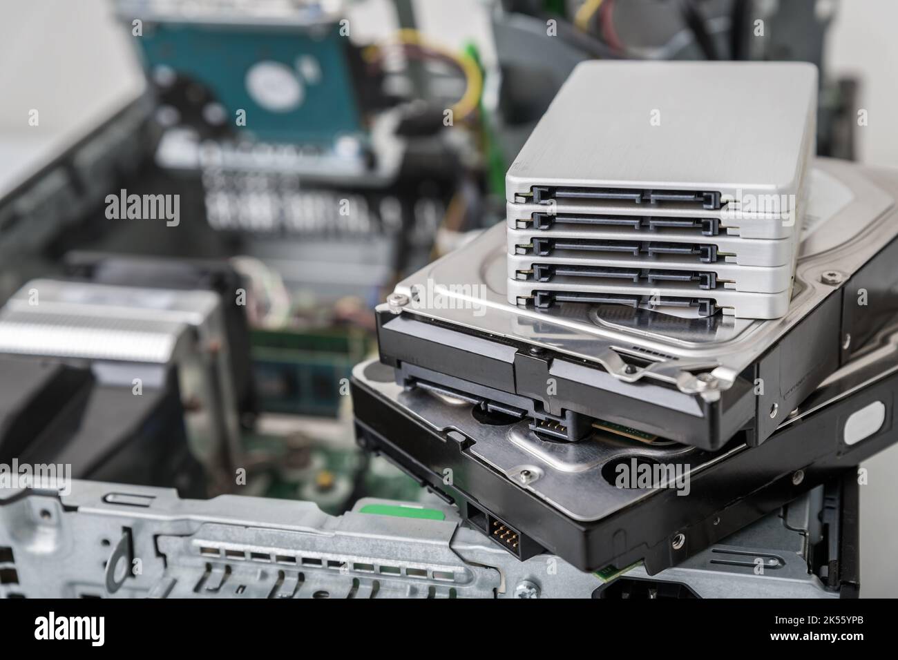 Closed-up view of SSD and SATA hard disk drives on top of computer. Repair and dat recovery concept Stock Photo
