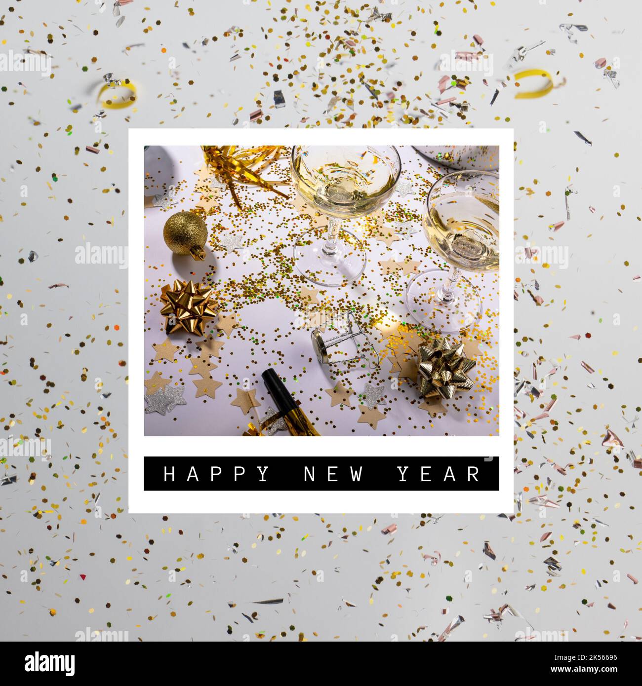 Square image of photo with happy new year and confetti on white background Stock Photo