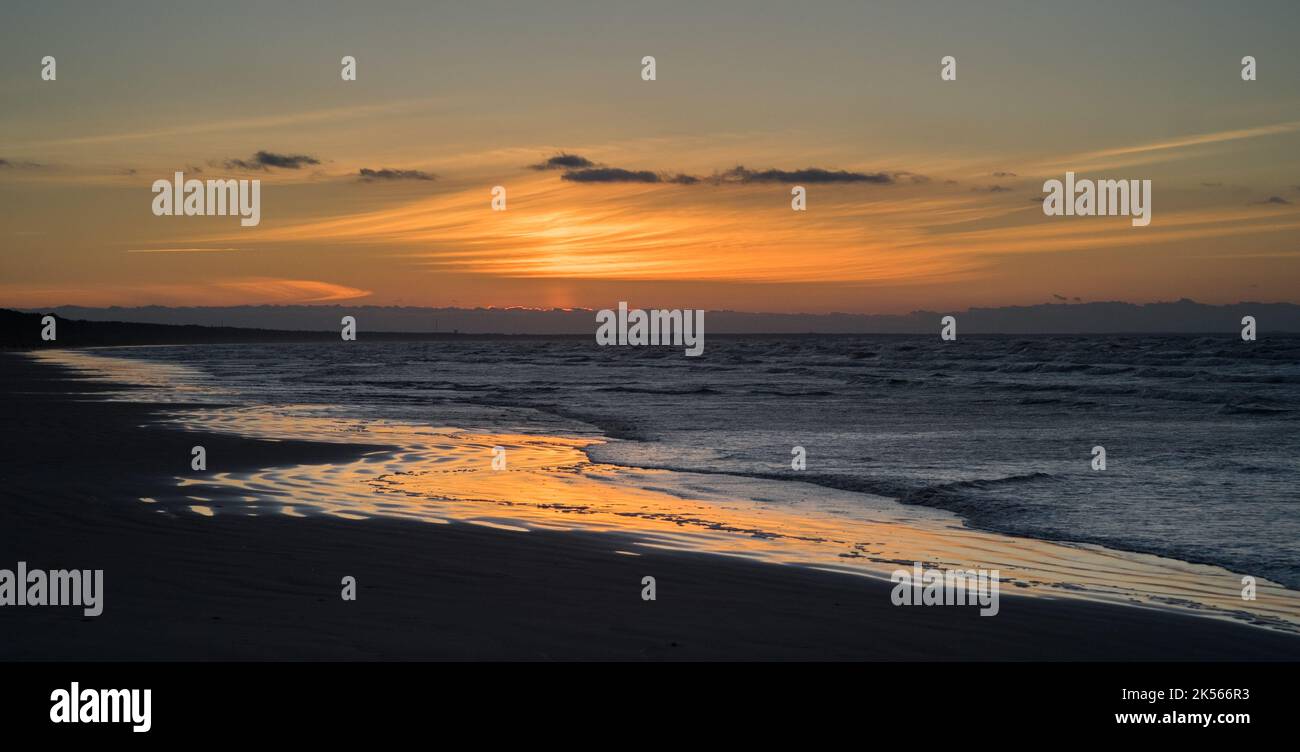 Baltic sea coast beach sunset afterglow Stock Photo