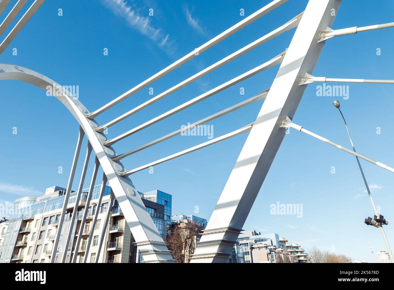 Lazarevsky Bridge is road metal cable-stayed bridge across Malaya Nevka river, Saint Petersburg, Russia. Cable stayed bridge supports, cable stays and Stock Photo