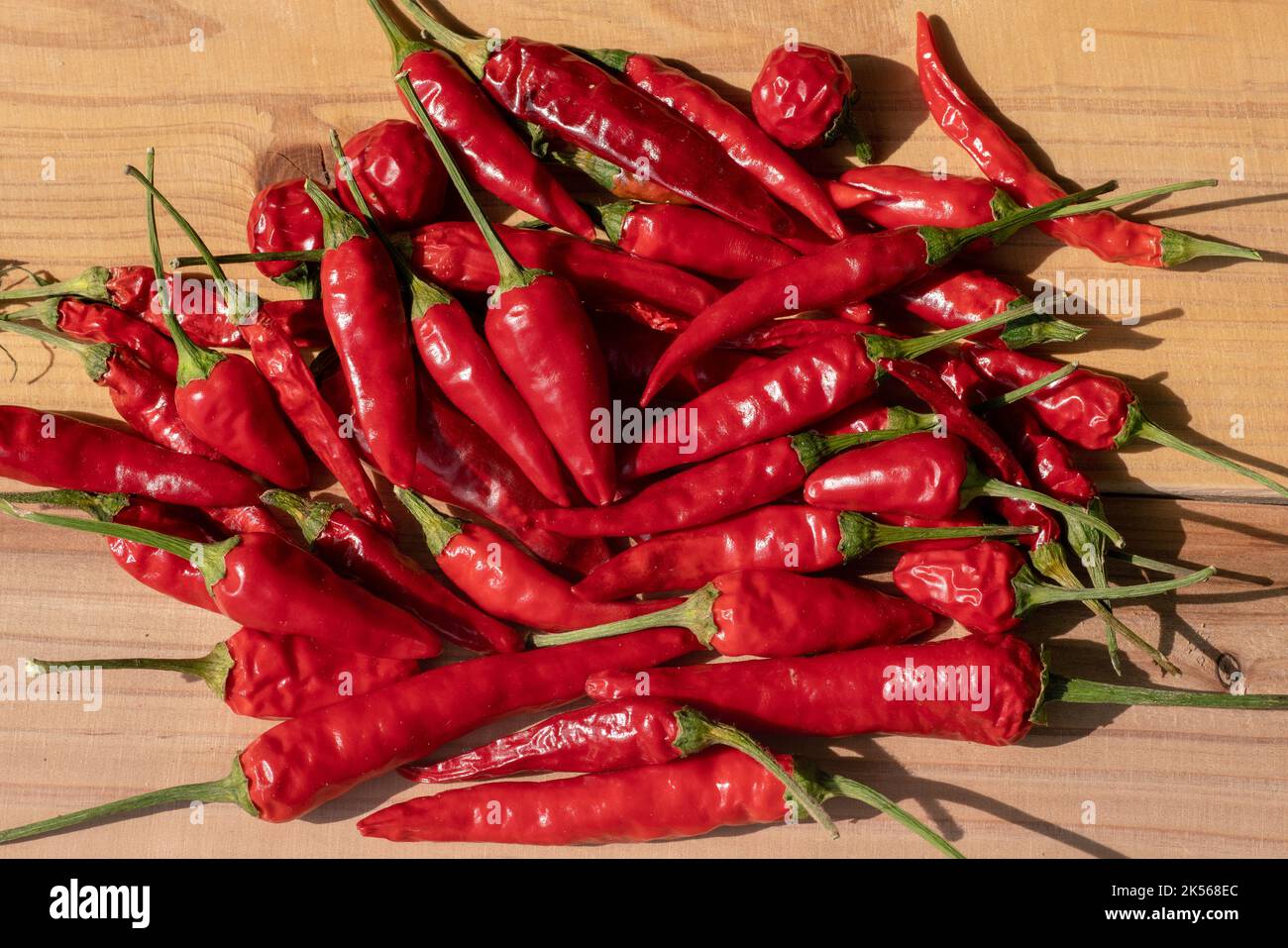 red pepper on table, very popular ingredient that makes the kitchen delights very tasty. The spicy is very popular in popular dishes. Stock Photo