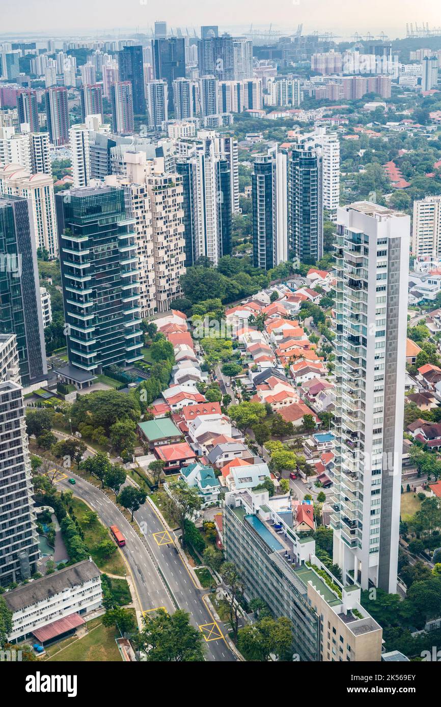 Urban Growth.  Singapore City View from Top of Ion Mall Looking West.   Highrise Apartment and Office Buildings Surround Lowrise Construction of an Ea Stock Photo