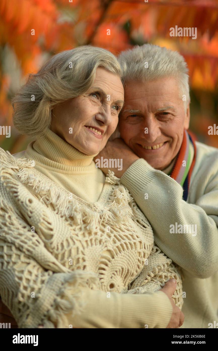 Nice elderly couple in a autumn park Stock Photo - Alamy