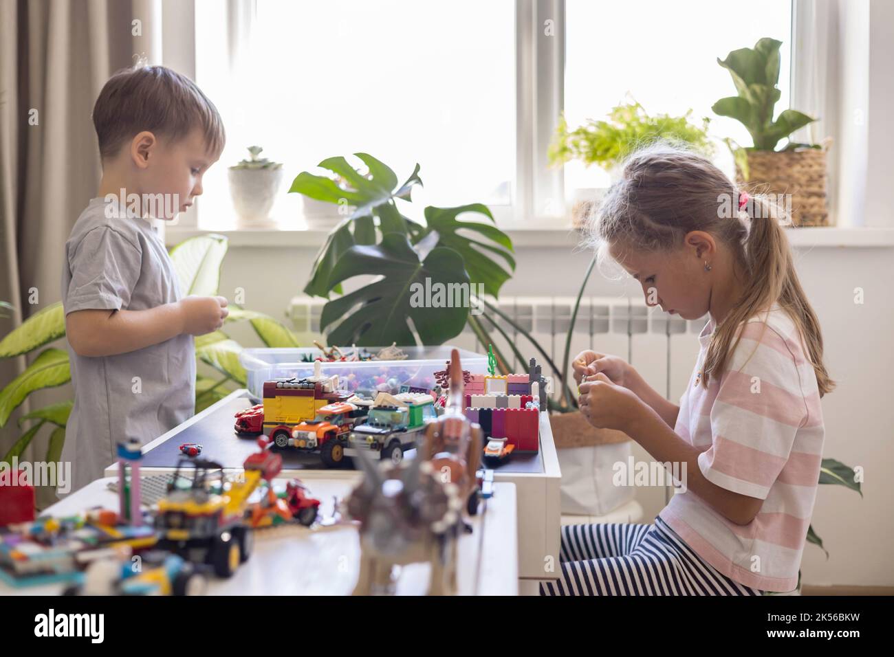 Children Using Lego Khabarovsk, Russia, August 26, 2022. Children constructing toy cars and ...