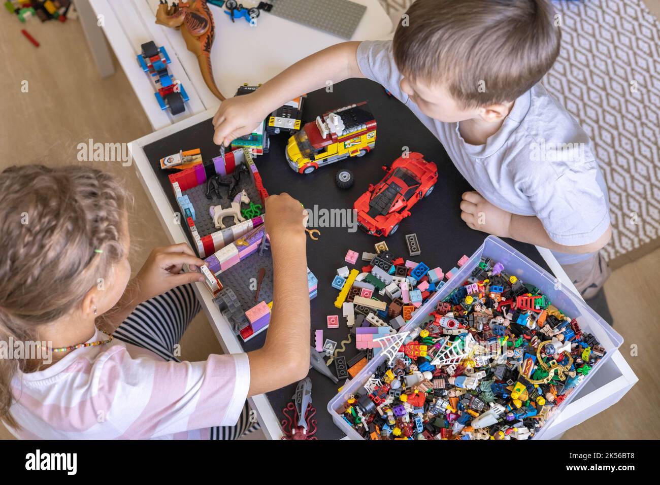 Children Using Lego Khabarovsk, Russia, August 26, 2022. Children constructing toy cars and ...
