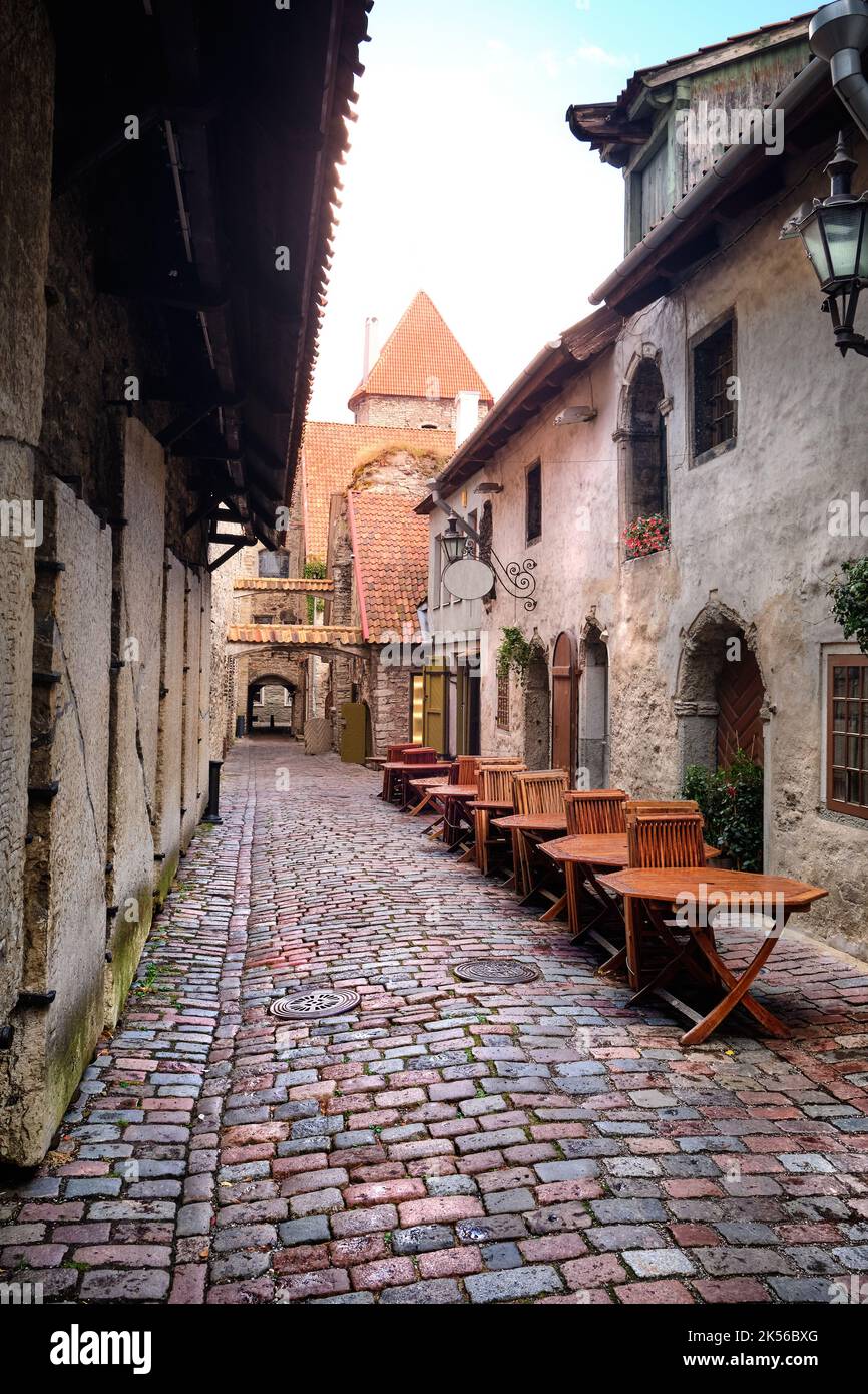 Catherine Lane in Tallinn, Estonia, on a rainy day. Wet tables and