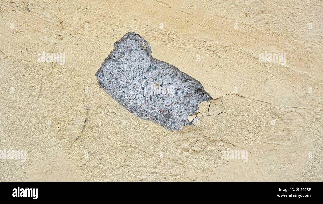 Cracked yellow wall. Stock Photo