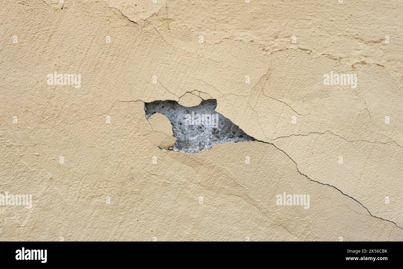 Cracked yellow wall. Stock Photo