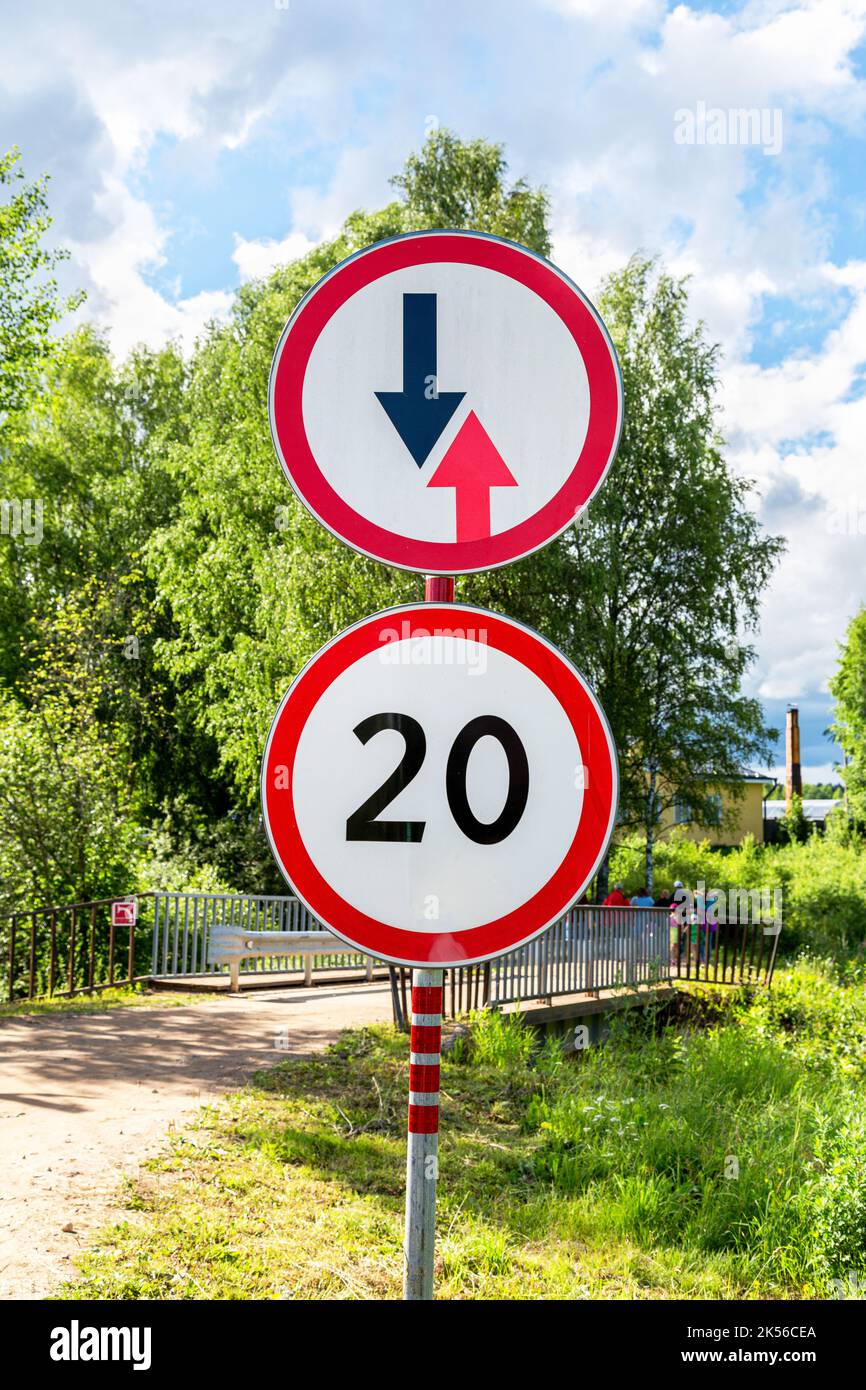 Road signs on a country road on a summer day Stock Photo