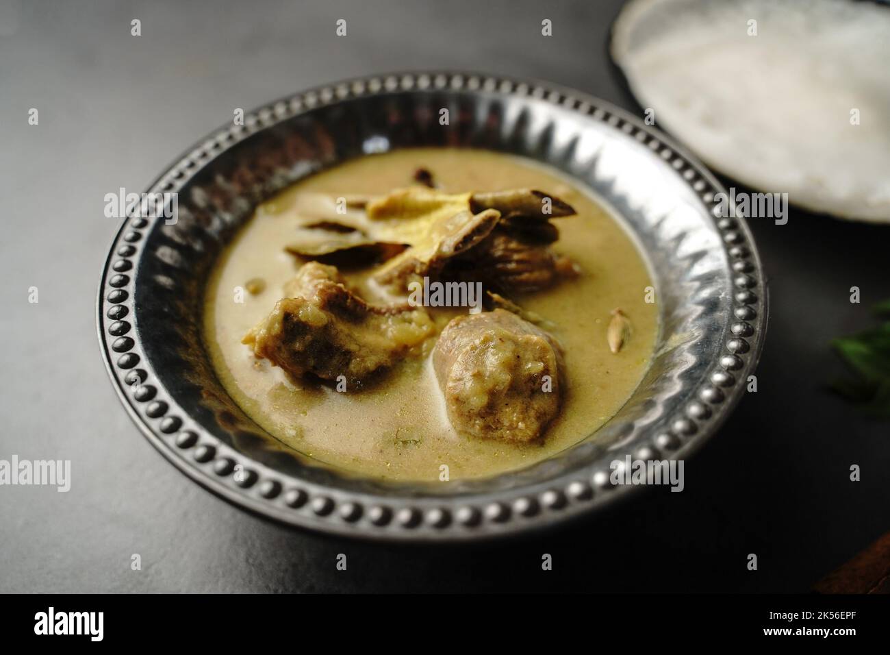 Lamb stew or Mutton in coconut milk gravy served with Appam- Kerala breakfast Stock Photo