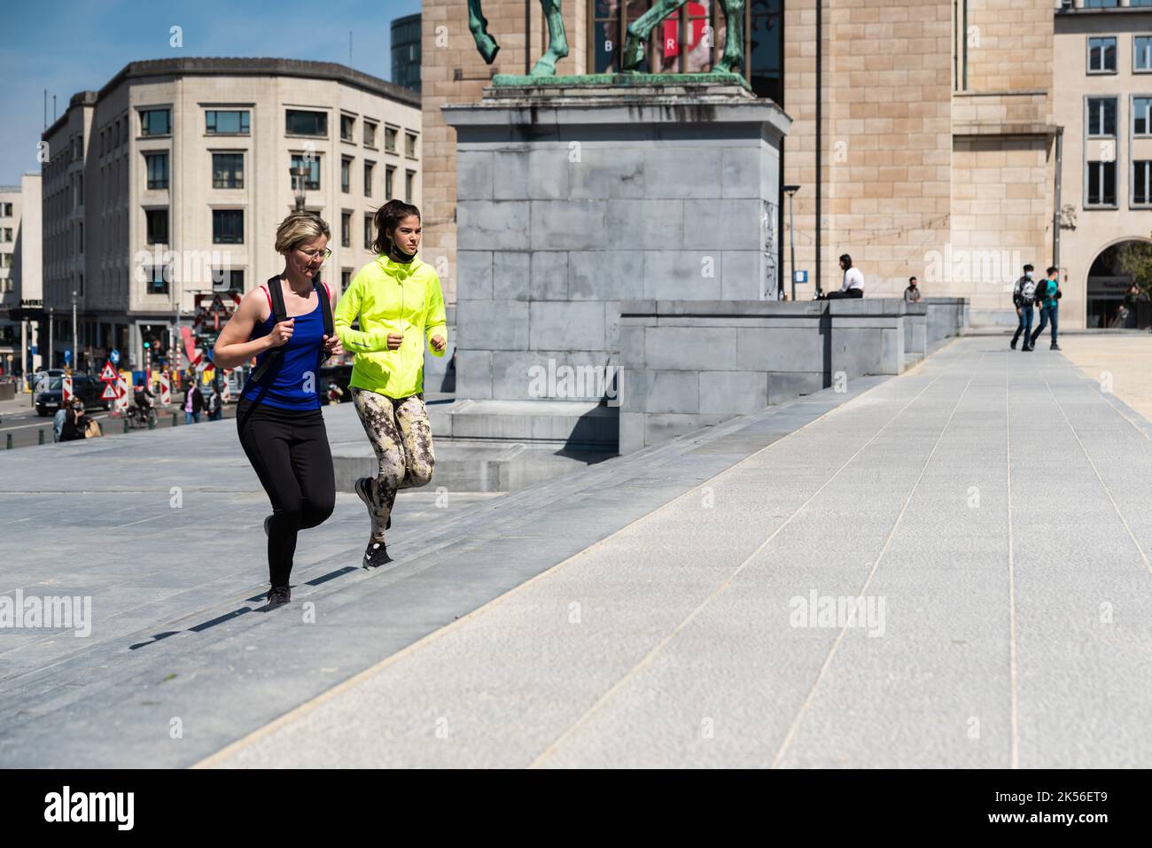 Brussels City Center, Brussels Capital Region - Belgium - 05 01 2021 Two girls jogging in the park of Mont des Arts, high angle view Stock Photo