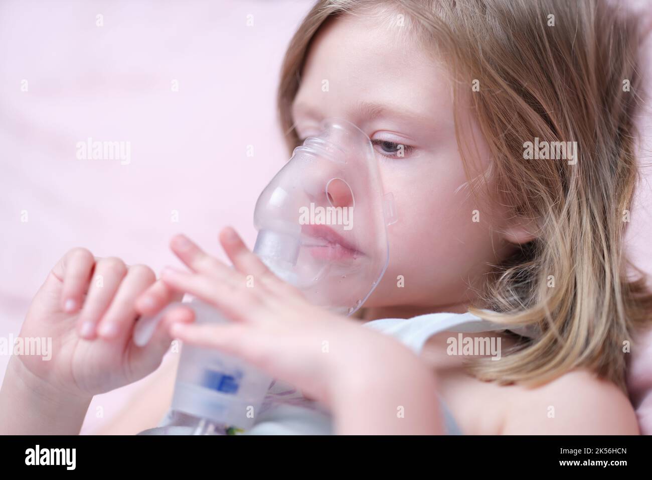 Portrait of child girl with inhaler for asthma Stock Photo Alamy