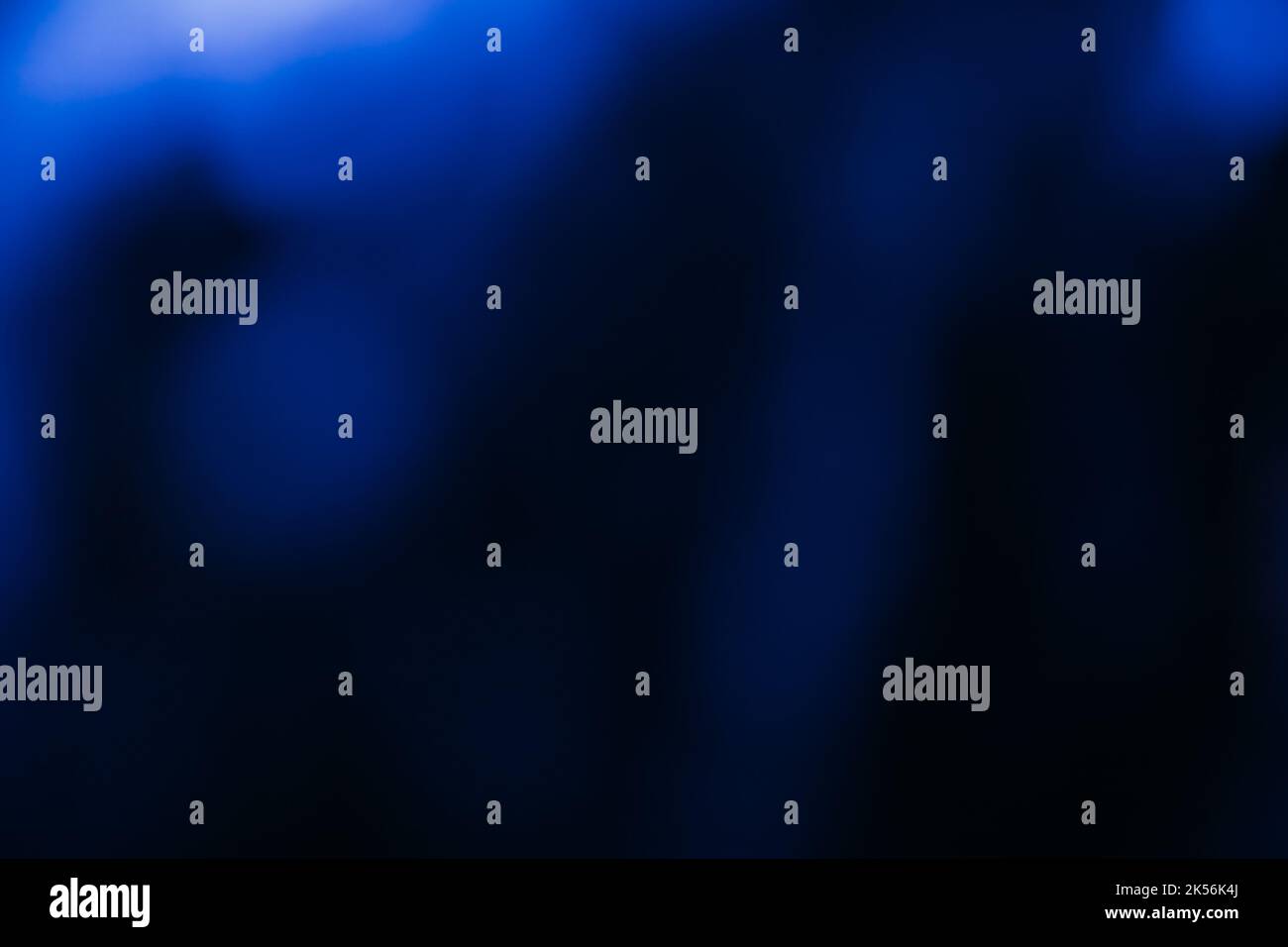 blur glow background bokeh rays neon blue black Stock Photo