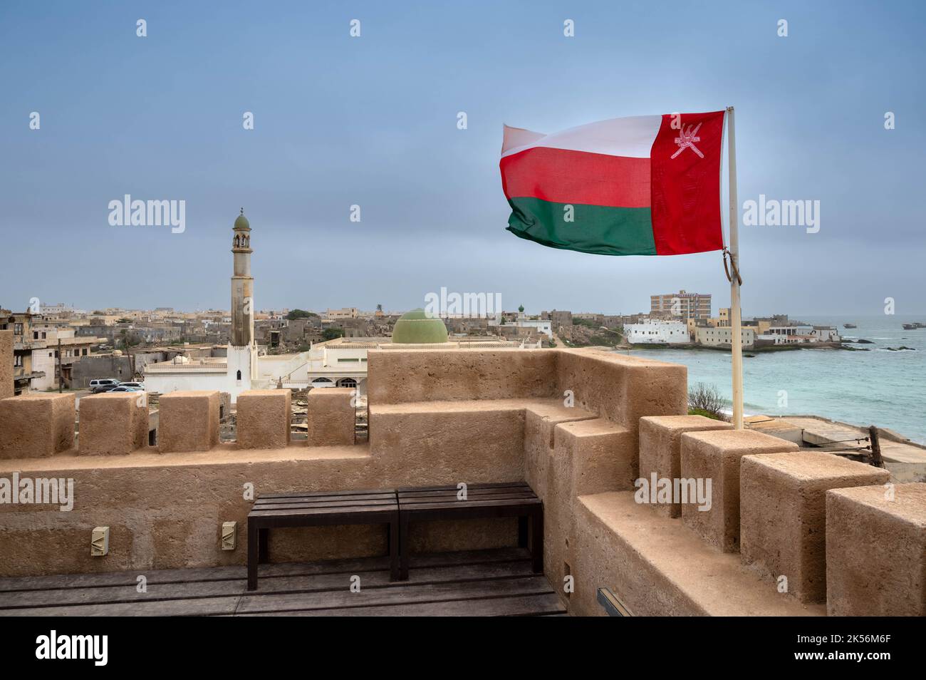 Omani flag on top of Mirbat Fort close to Salalah, Oman Stock Photo