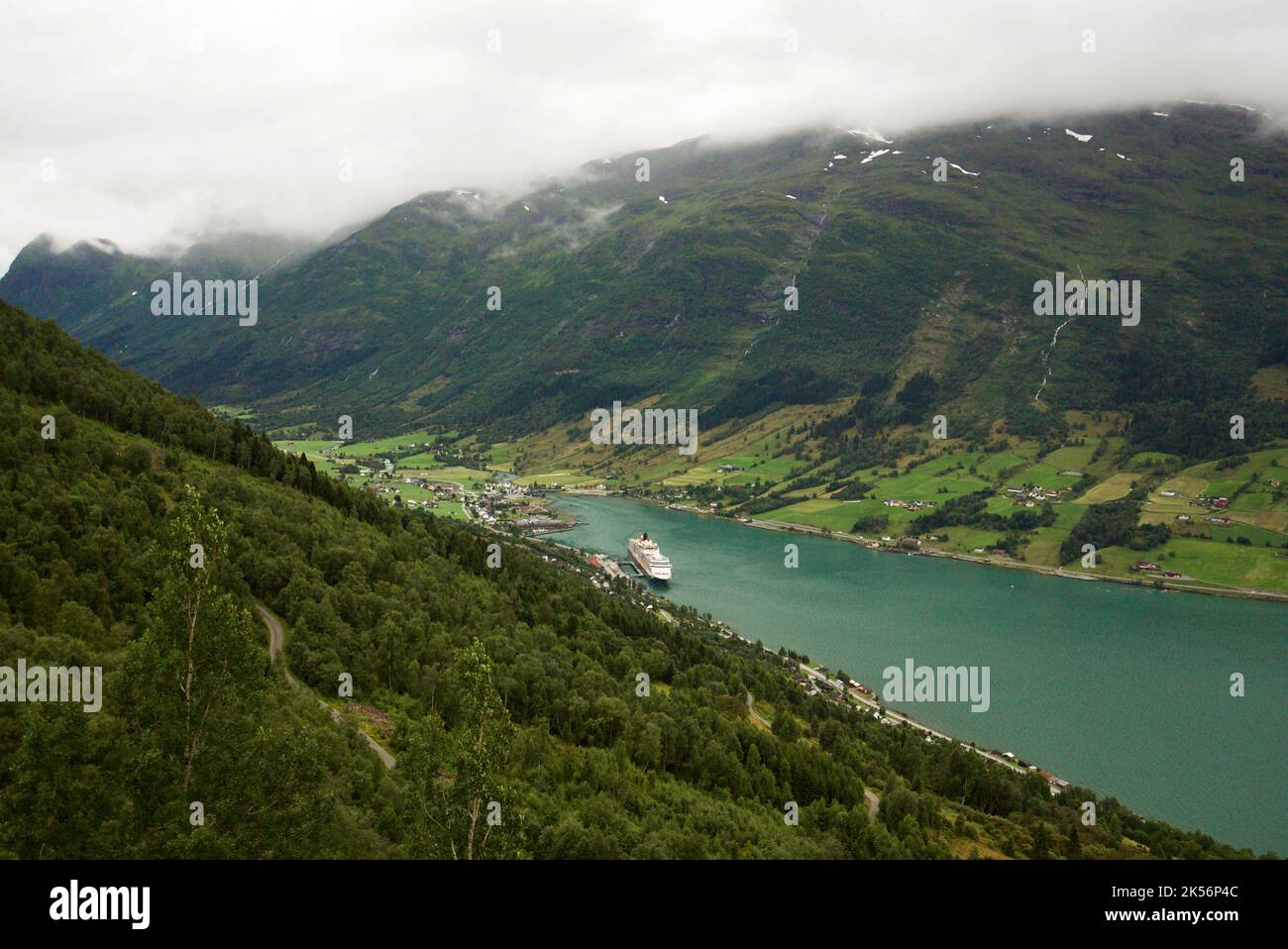The view from the Huaren view point, Olden. Queen Victoria cruise ship, a Cunard cruise docked in the dock of Olden, Stryn, Vestland county, Norway. Stock Photo