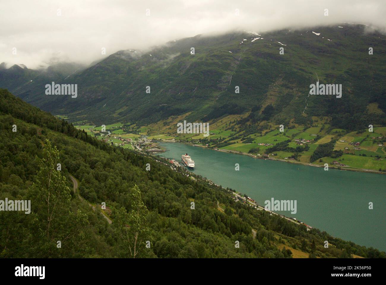 The view from the Huaren view point, Olden. Queen Victoria cruise ship, a Cunard cruise docked in the dock of Olden, Stryn, Vestland county, Norway. Stock Photo