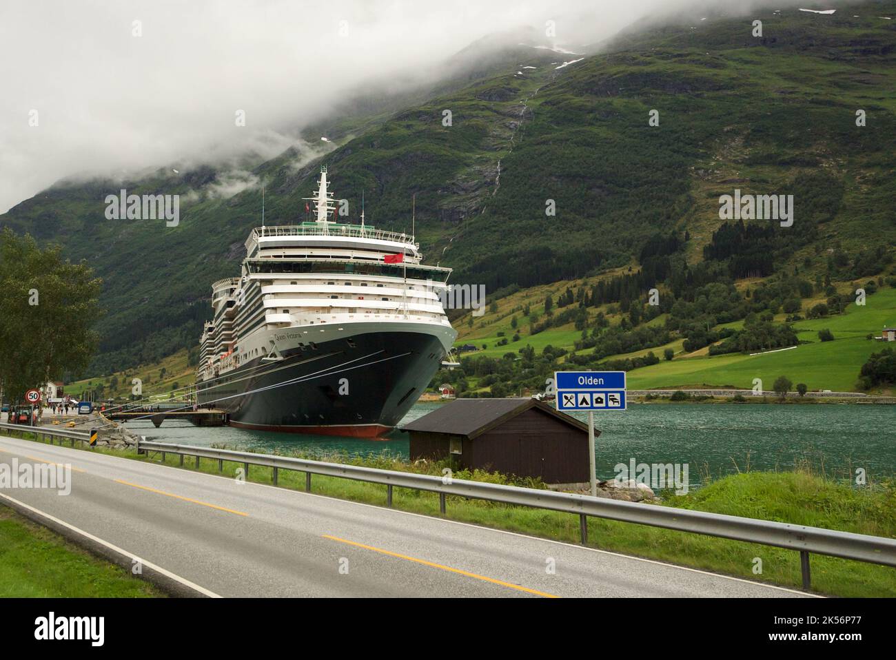 Queen Victoria cruise ship, a Cunard cruise docked in the dock of Olden, Stryn, Vestland county, Norway. Cunard Queen Victoria, Norwegian Fjords. Stock Photo