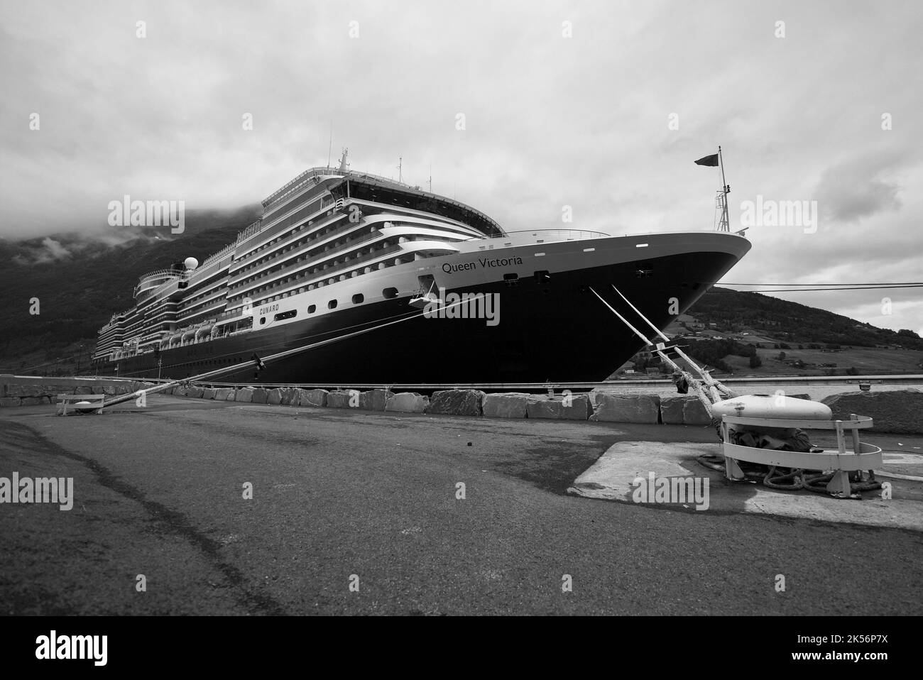 Cunard Queen Victoria cruise ship, a cruise docked in the dock of Olden, Stryn, Norway, Norwegian Fjords. Ship tied to cleat. Boat tied to cleats. Stock Photo