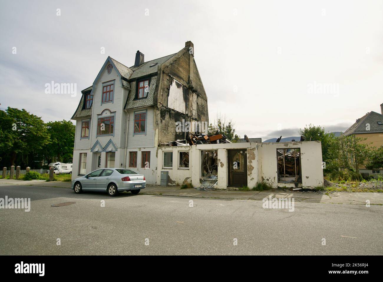 Exterior view of a burnt down house, where half of the building has