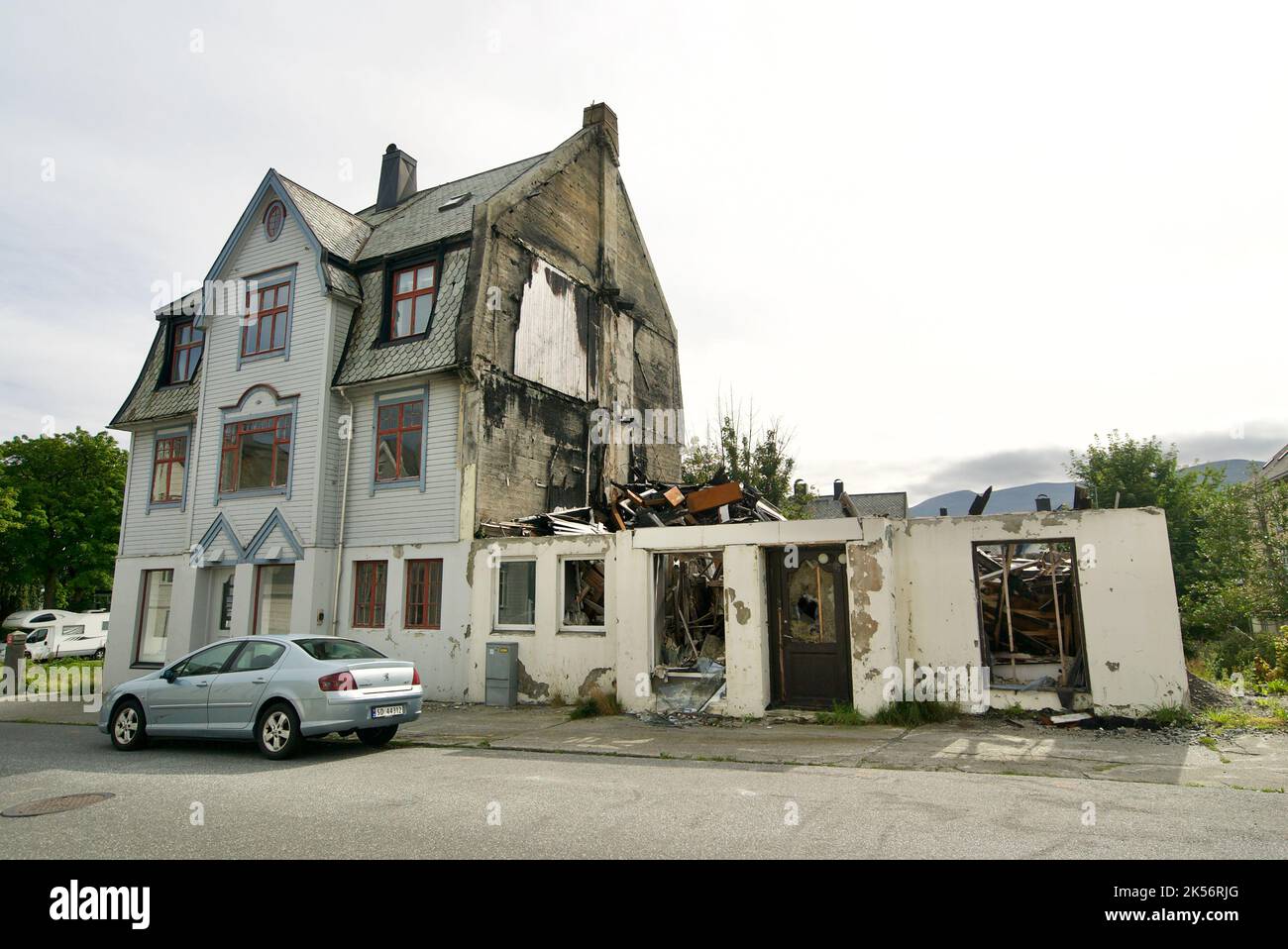 Exterior view of a burnt down house, where half of the building has