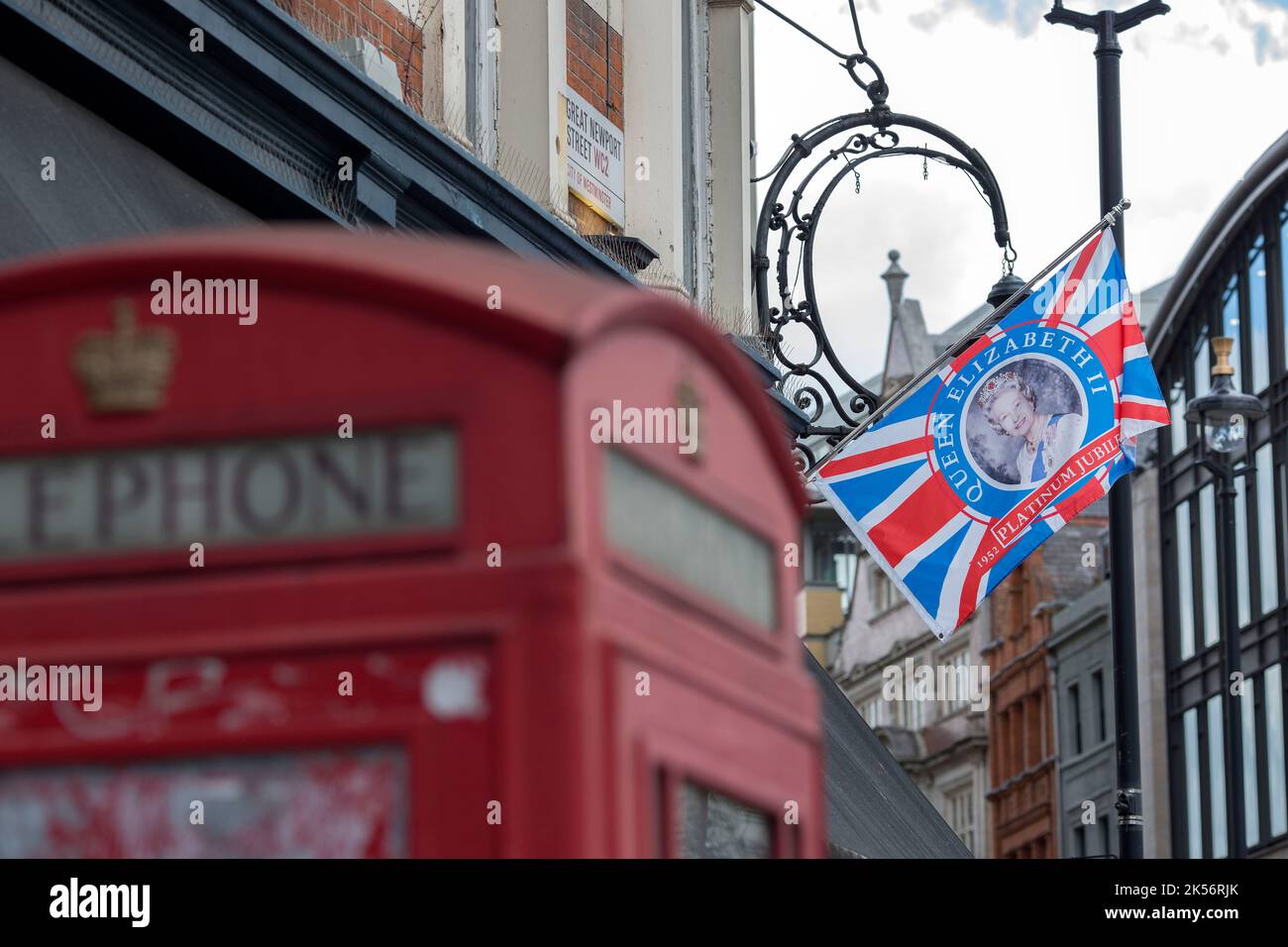 A Union flag featuring a portrait of Britain’s Queen Elizabeth II is
