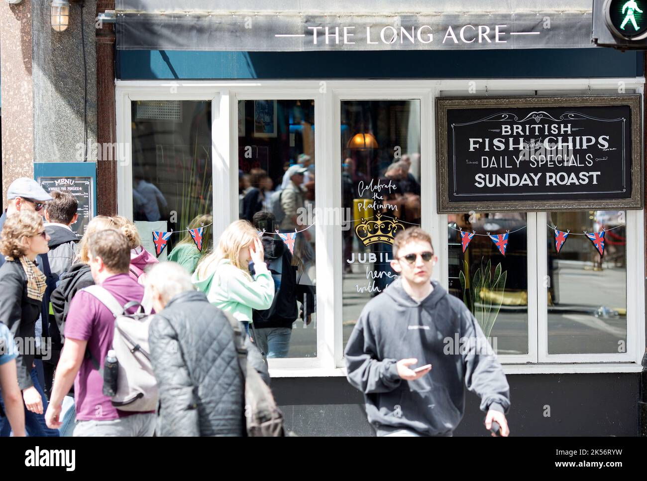 Platinum Jubilee decorations are seen on the window of a pub in central London ahead of the Platinum Jubilee celebrations. Stock Photo