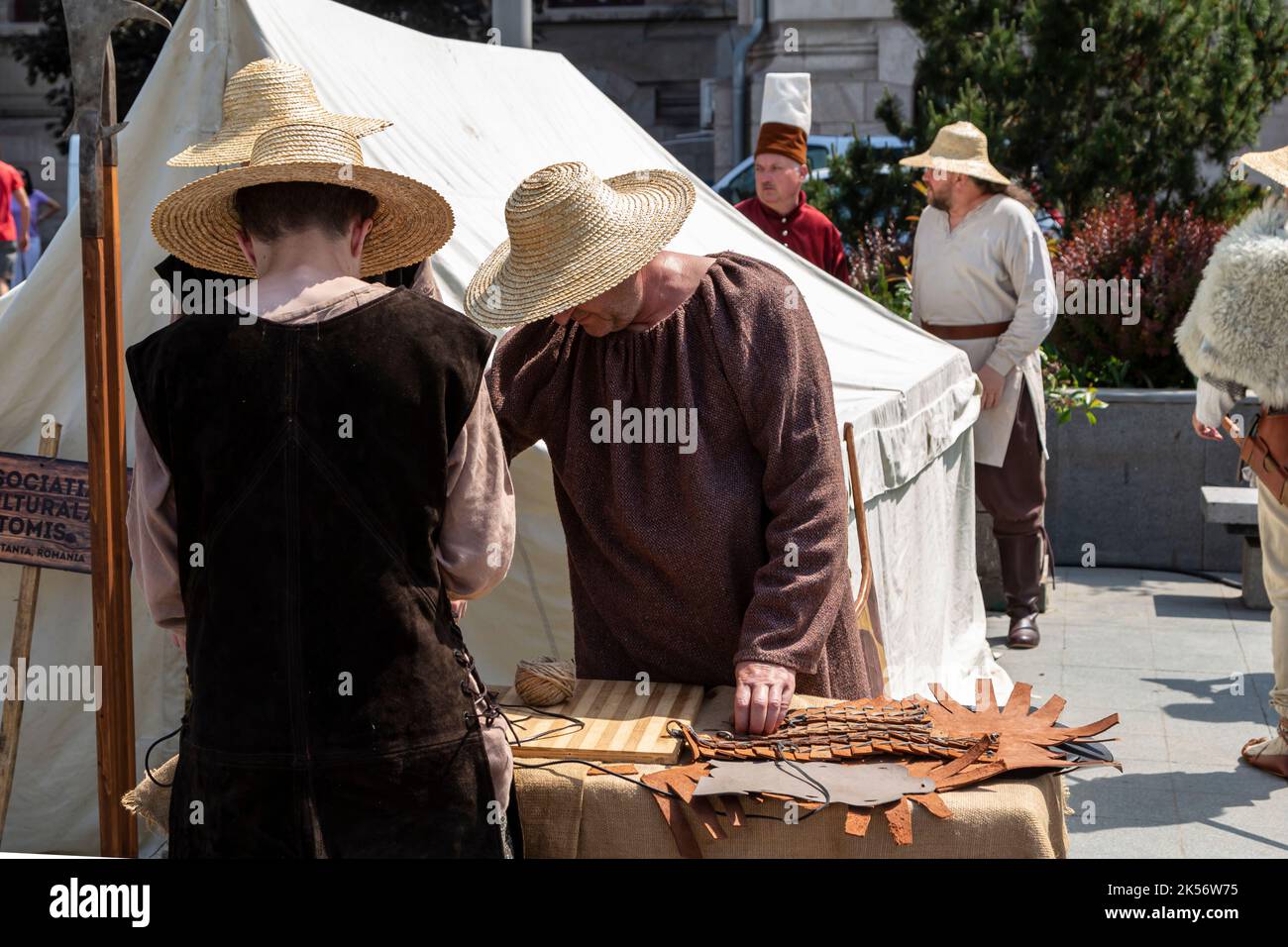 Craiova, Dolj County, Romania – May 14, 2022:  Medieval craftsmen in authentic historical clothing at a medieval festival Michael le Brave Stock Photo
