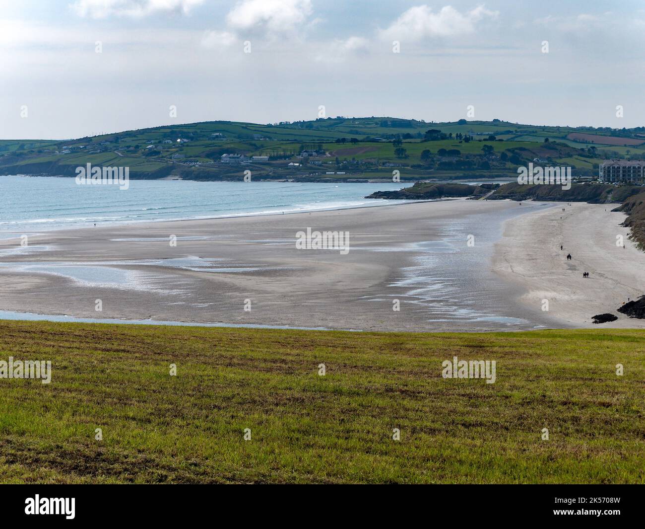 View of the sandy beach of Inchadoney at low tide. The picturesque coast of the Atlantic Ocean in the south of Ireland near Clonakilty. A sandbank nea Stock Photo