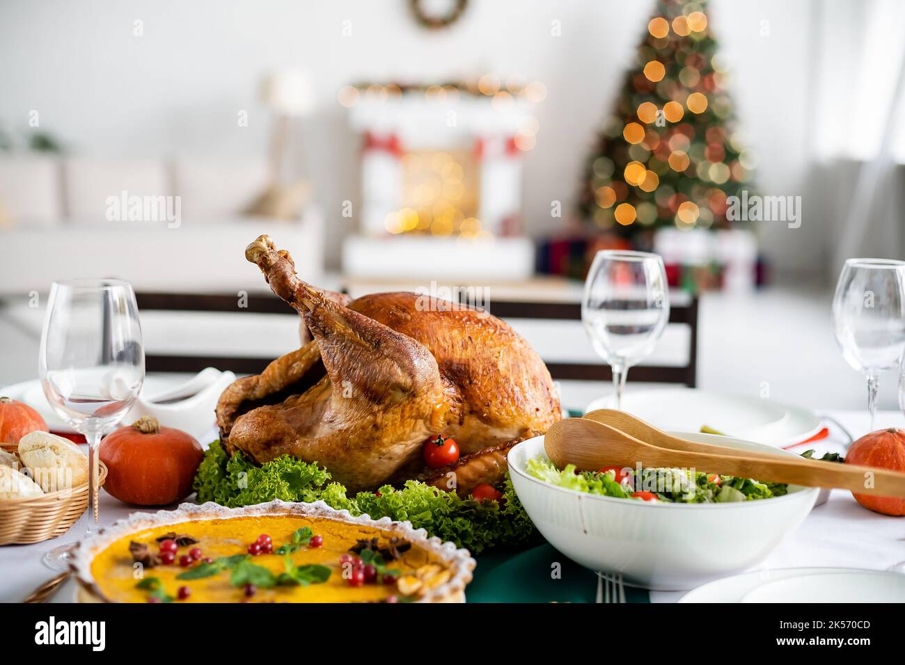 traditional thanksgiving dinner with roasted turkey and pumpkin pie ...