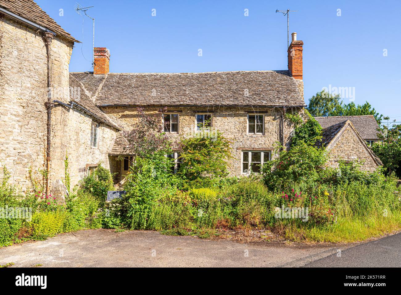 18th / 19th century Coln Mill and mill house in the Cotswold village of Coln St Aldwyns, Gloucestershire, England UK Stock Photo