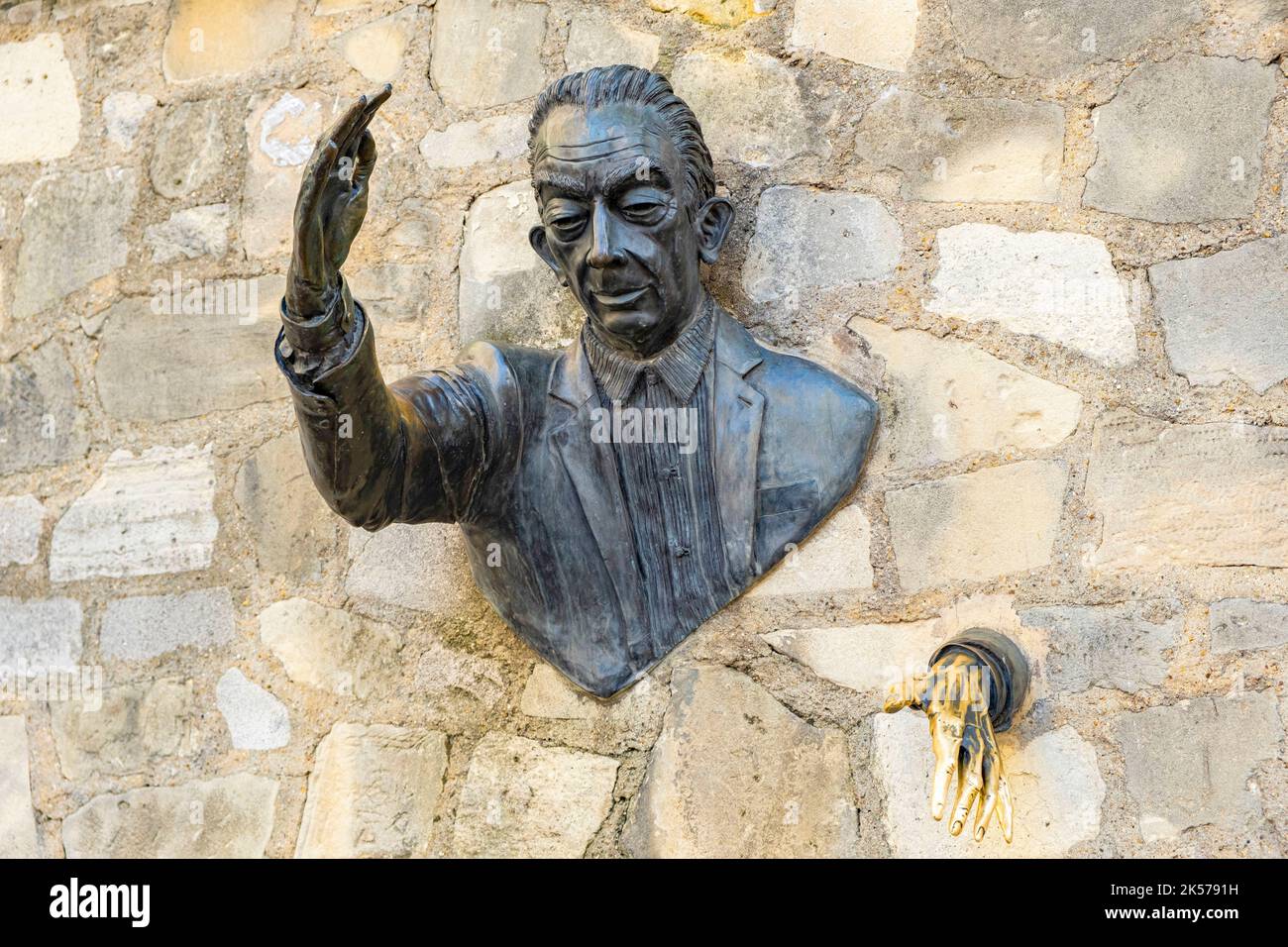 France, Paris, Montmartre, Passe-Muraille statue fixed in the wall of Place Marcel Aymé, created by actor Jean Marais in homage to the work of writer Marcel Aymé Stock Photo
