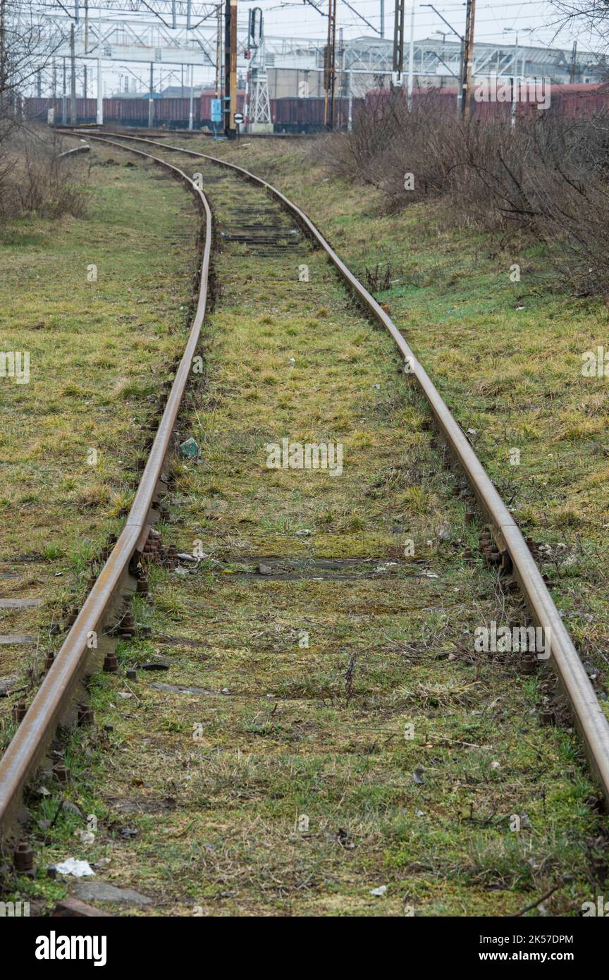 Railway infrastructure, tracks, rails and power cables over the tracks ...