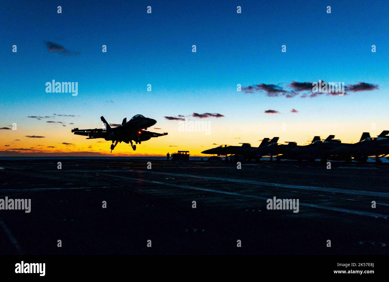 USS Ronald Reagan, South Korea. 05th Oct, 2022. A U.S. Navy F/A-18F Super Hornet fighter aircraft, attached to the Diamondbacks of Strike Fighter Squadron 102 lands at sunset on the flight deck of the Nimitz-class, nuclear-powered super-carrier, USS Ronald Reagan during operations in the Sea of Japan, October 5, 2022 near South Korea. Credit: MC2 Michael Jarmiolowski/US Navy Photo/Alamy Live News Stock Photo