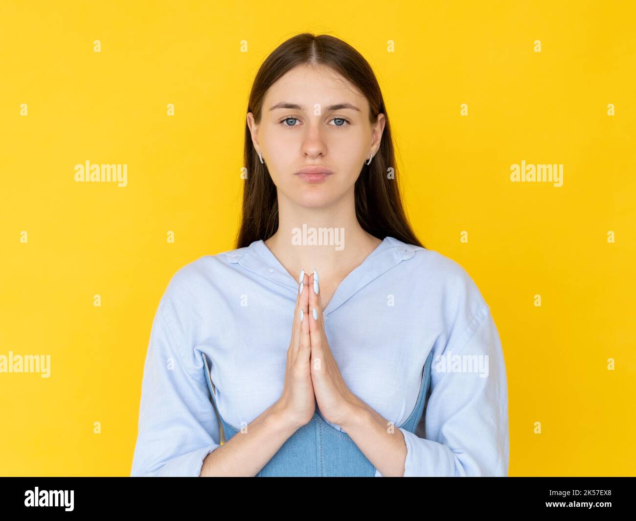 praying woman asking favor forgiveness hope pretty Stock Photo