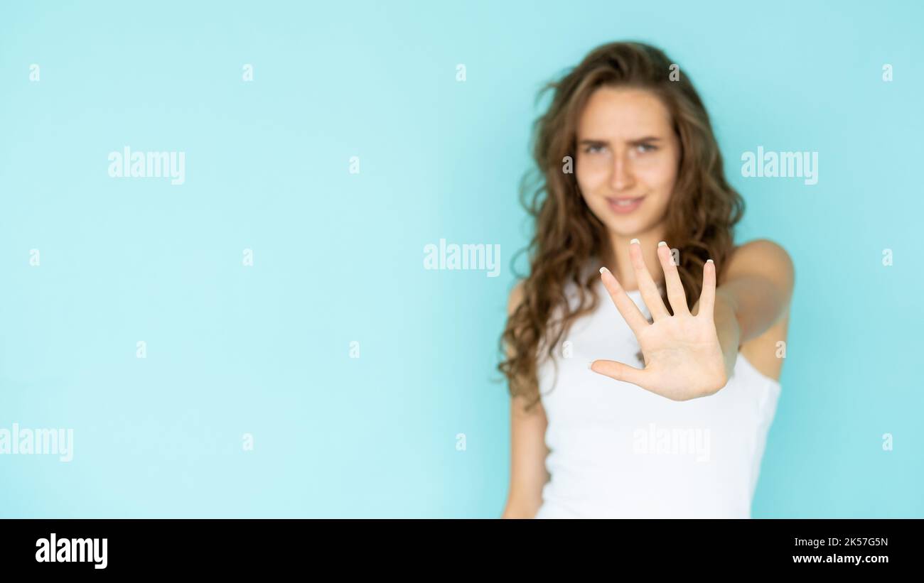 Woman holding up hand stop hi-res stock photography and images - Alamy
